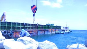 Hauling of armor rocks for breakwater repair in Bataan area using our rental tugboats and deck barges